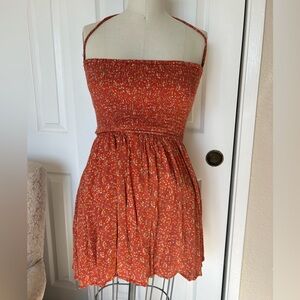 Lovely Day Orange Floral Smocked dress with backless detail size L.